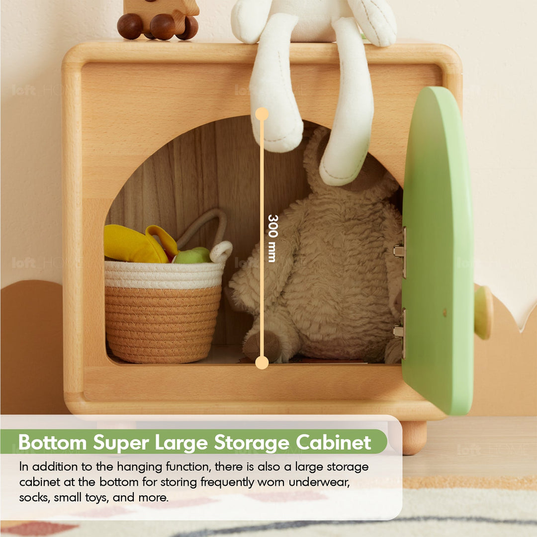 Scandinavian wood kids cloth hanger huggy in still life.