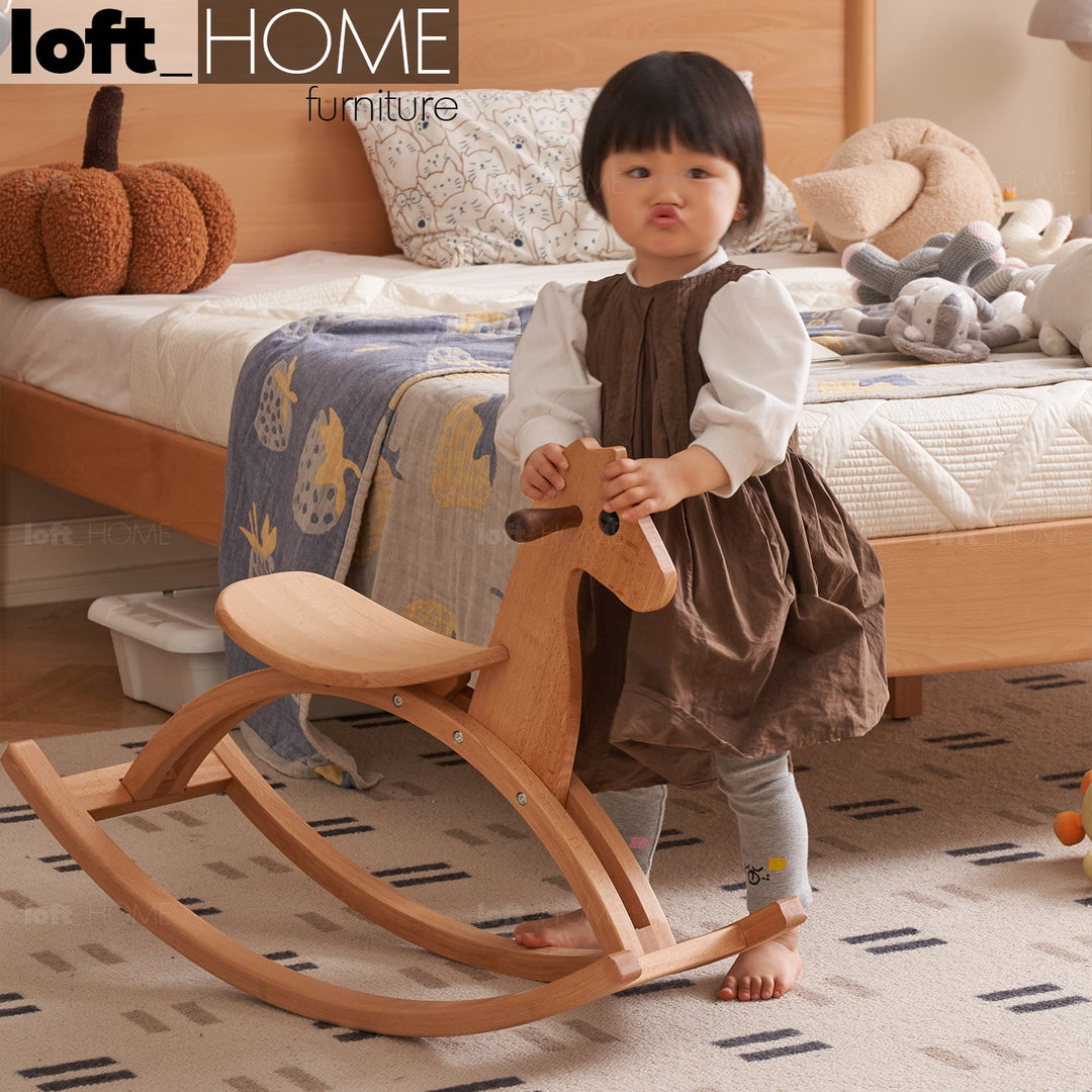 Scandinavian wood kids rocking horse primary product view.