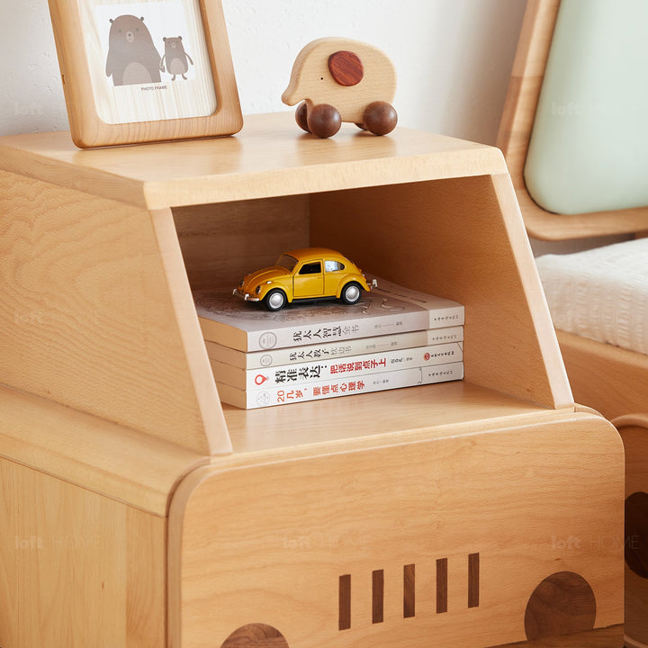 Scandinavian wood kids side table car with context.