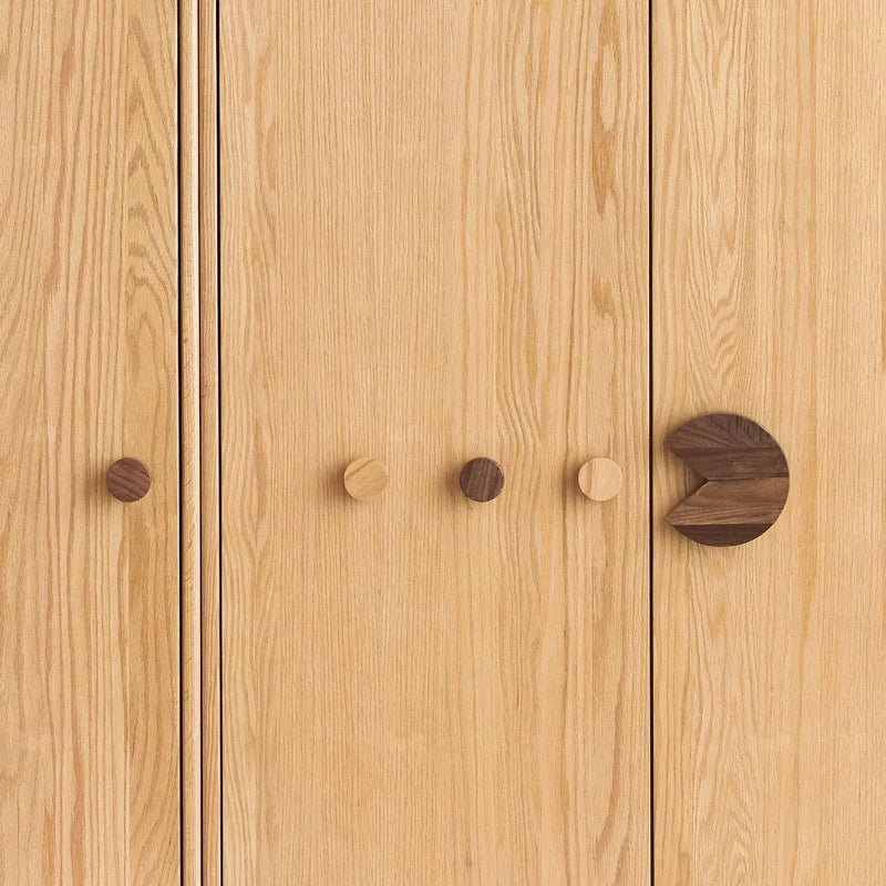 Scandinavian wood kids wardrobe pacman in close up details.