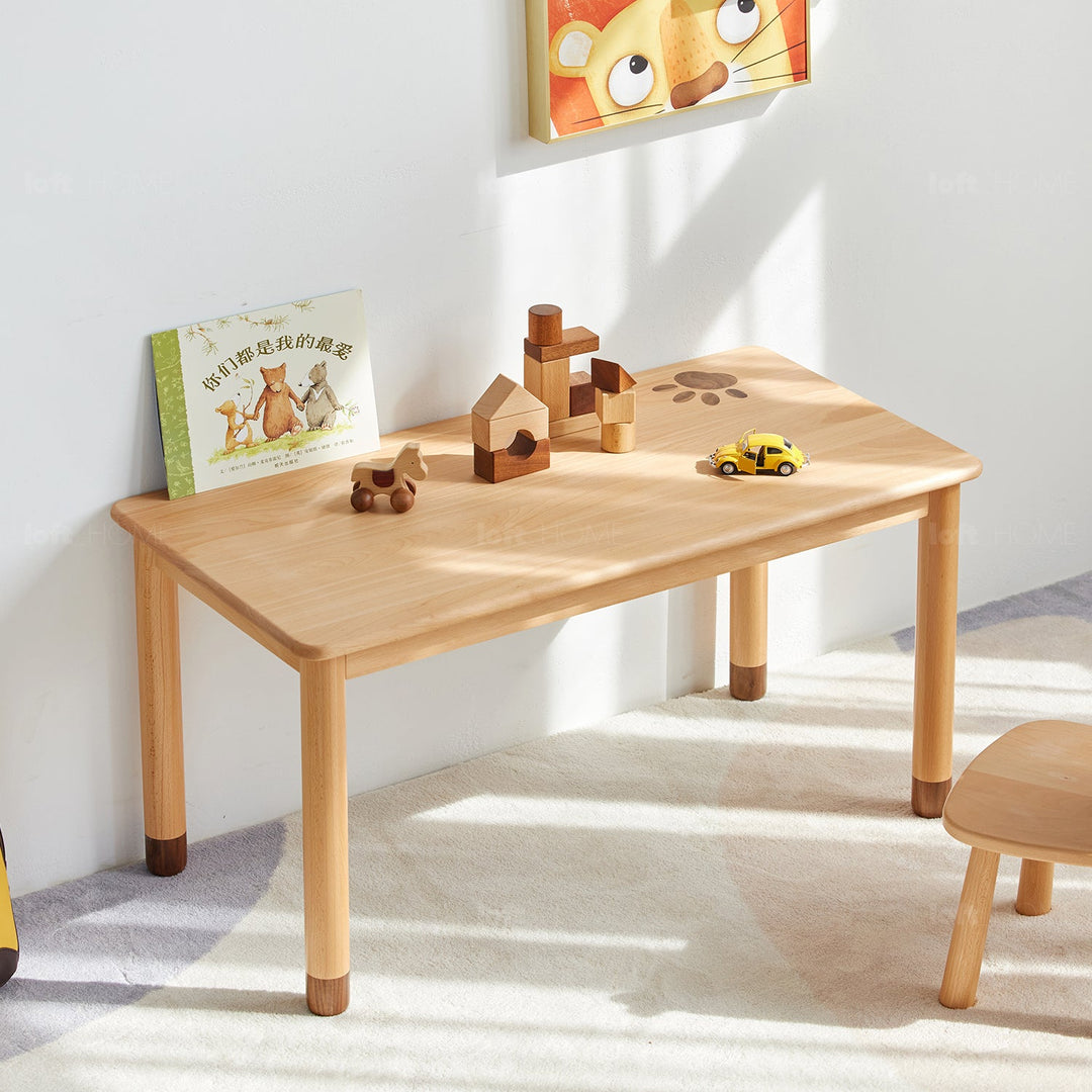 Scandinavian wood rectangle kids table bear in close up details.
