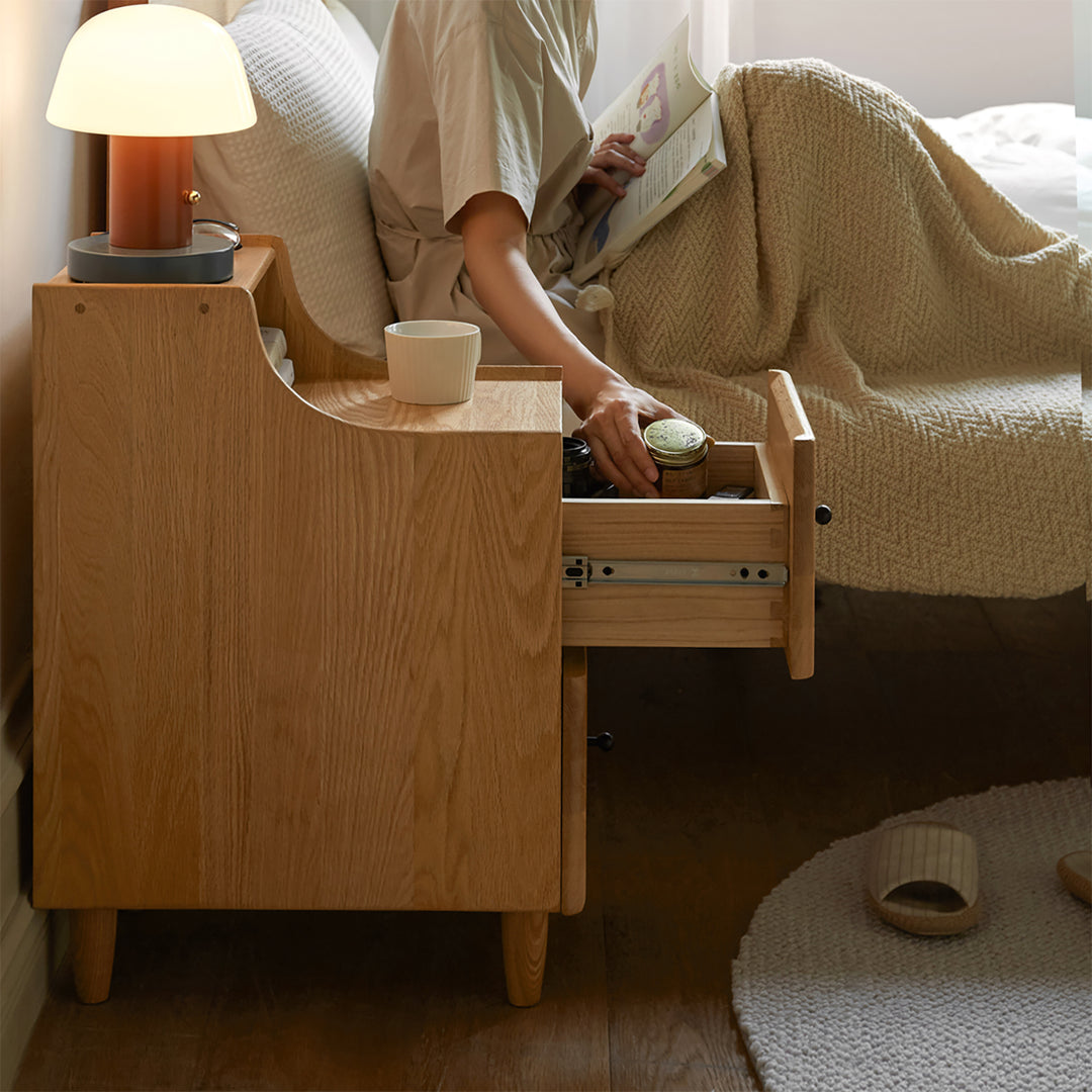 Scandinavian wood side table beside in panoramic view.