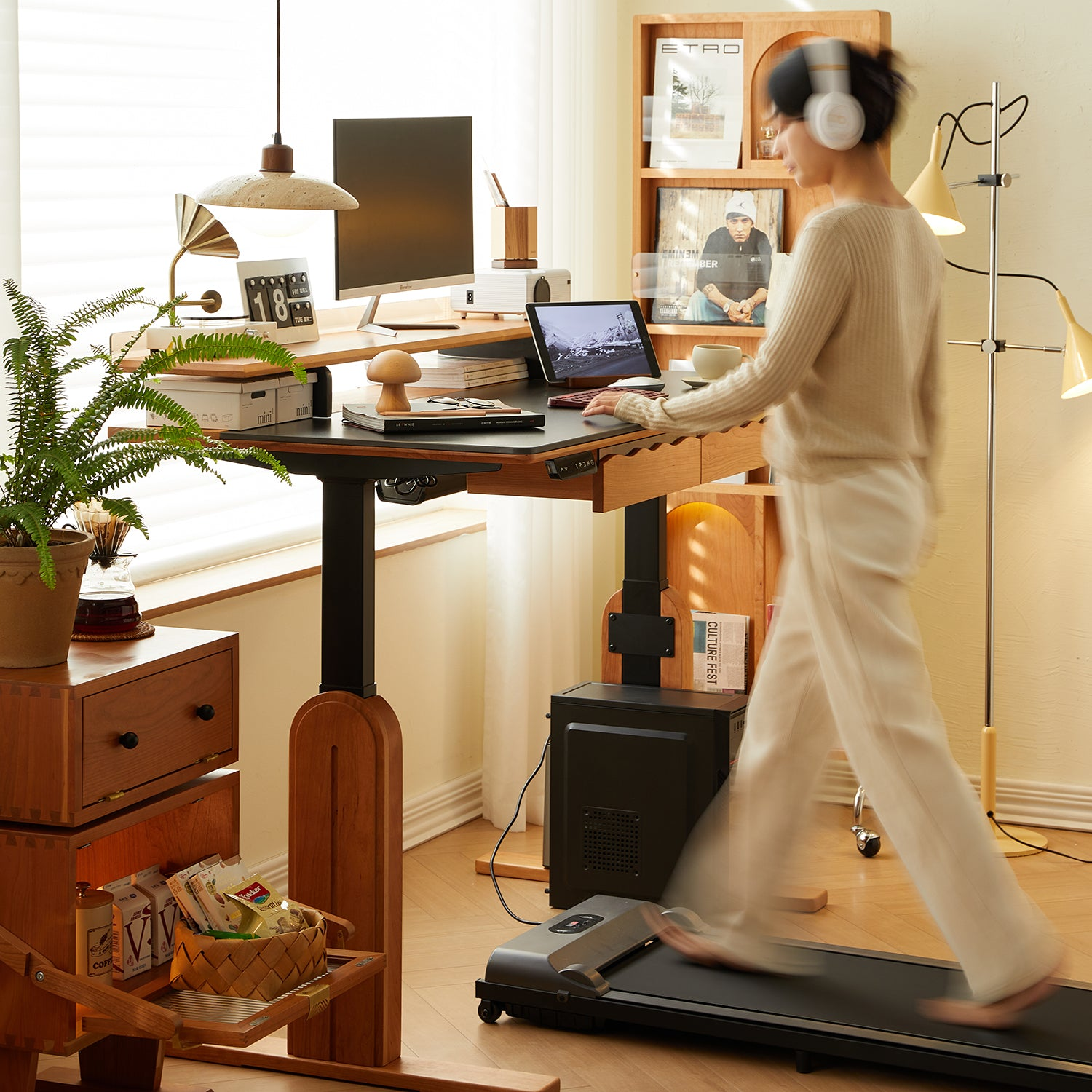 Scandinavian home office with a standing desk, treadmill, wooden shelves, and a woman walking while working, creating a modern and productive workspace.