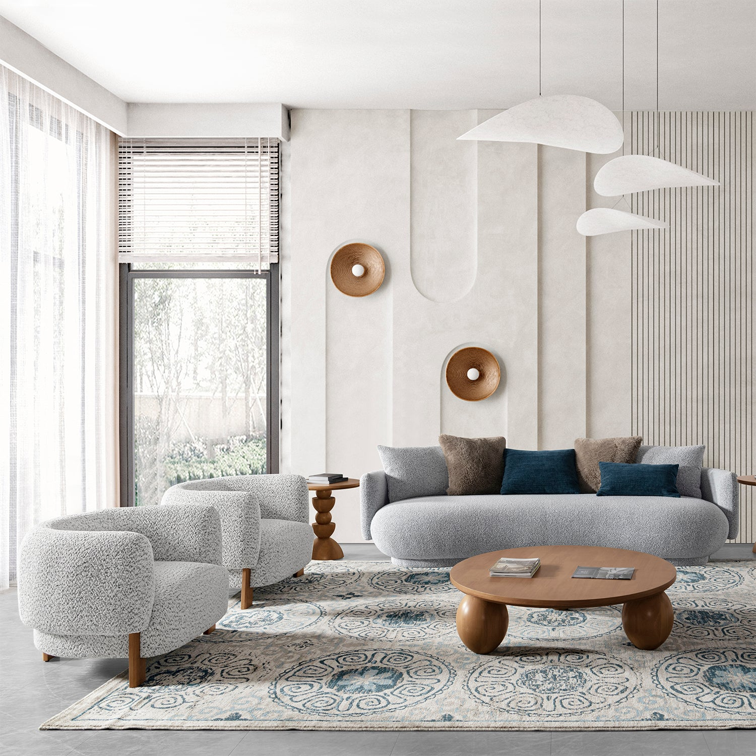 Modern living room with gray curved sofa, matching armchairs, wooden coffee table, abstract wall decor, and floor-to-ceiling windows, creating a stylish, serene ambiance.