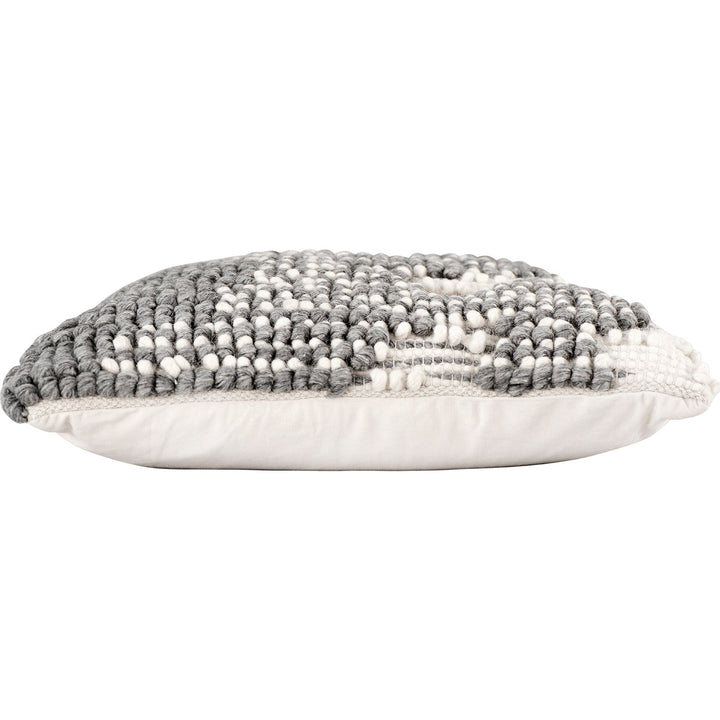 Versatile hand-woven wool looped pillow in real life style.