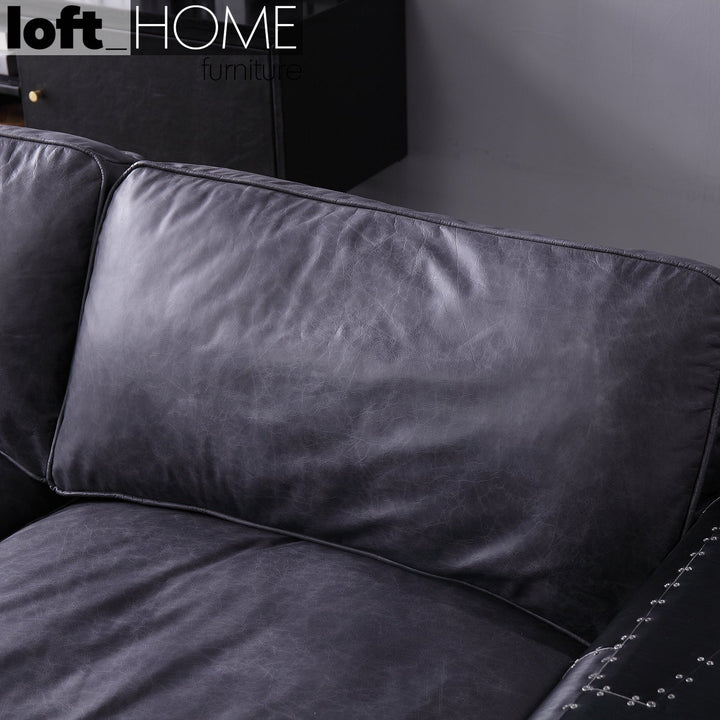 Vintage aluminium genuine leather 3 seater sofa black aircraft in still life.