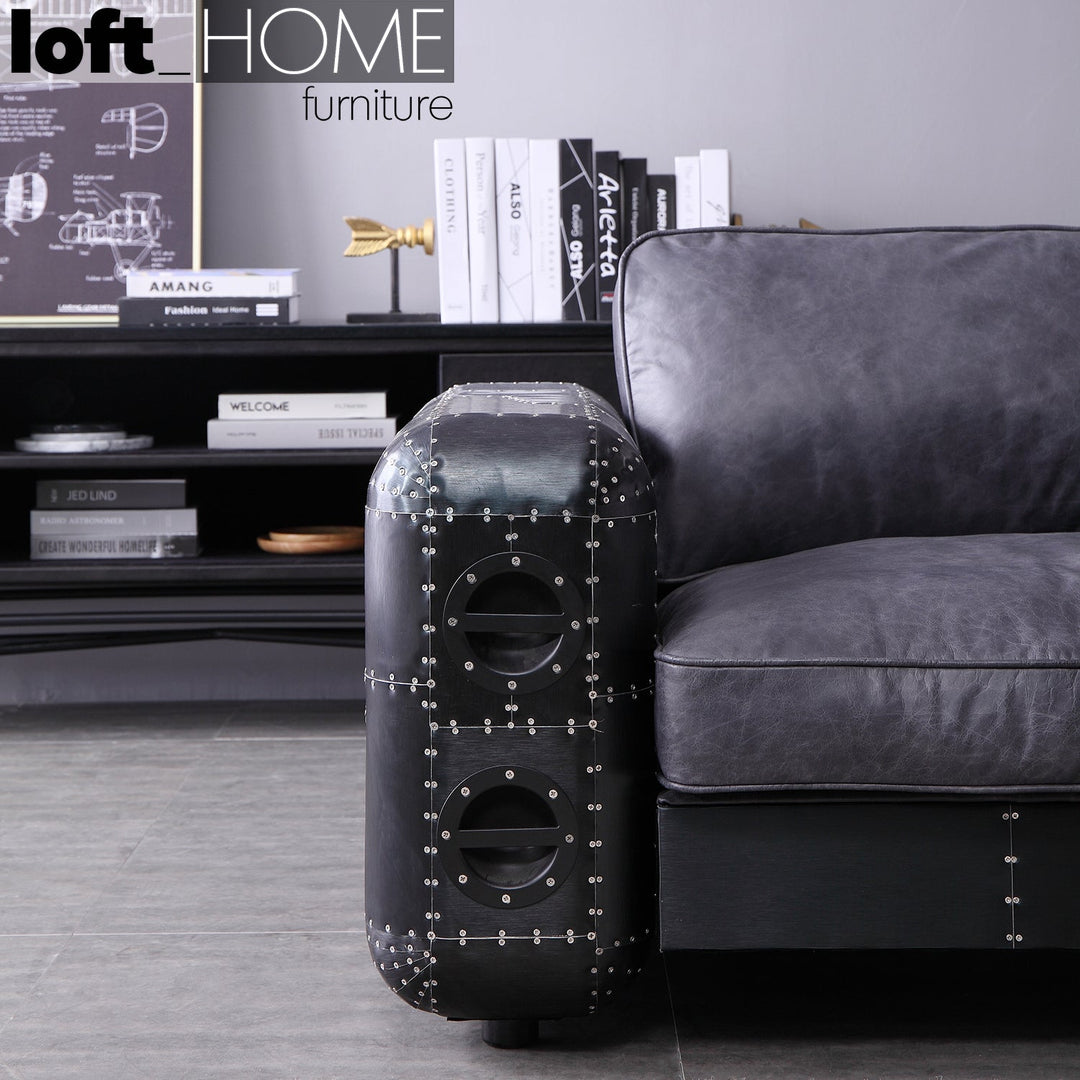 Vintage aluminium leather 2 seater sofa black aircraft in close up details.