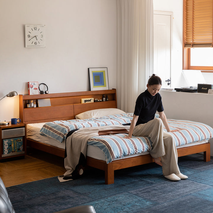 Vintage boxwood bed accompany light in still life.