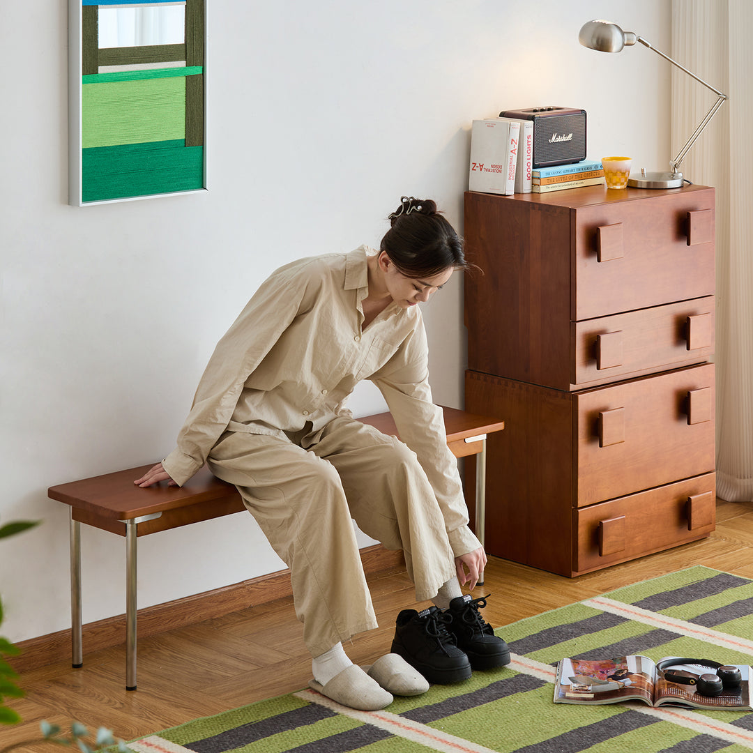 Vintage boxwood dining bench pinecone in still life.