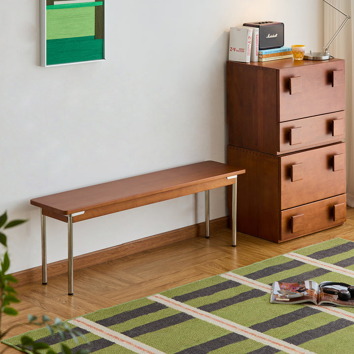 Vintage boxwood dining bench pinecone in close up details.