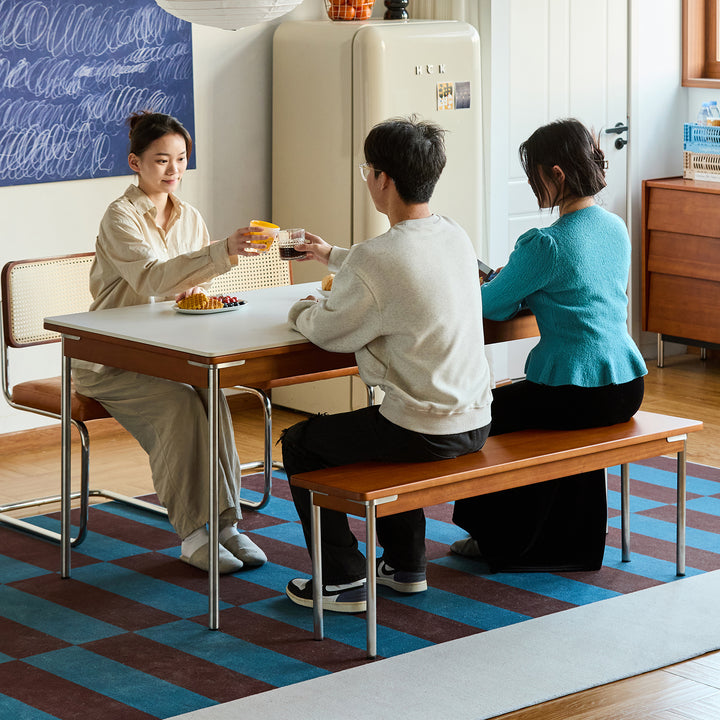 Vintage boxwood dining bench pinecone in panoramic view.