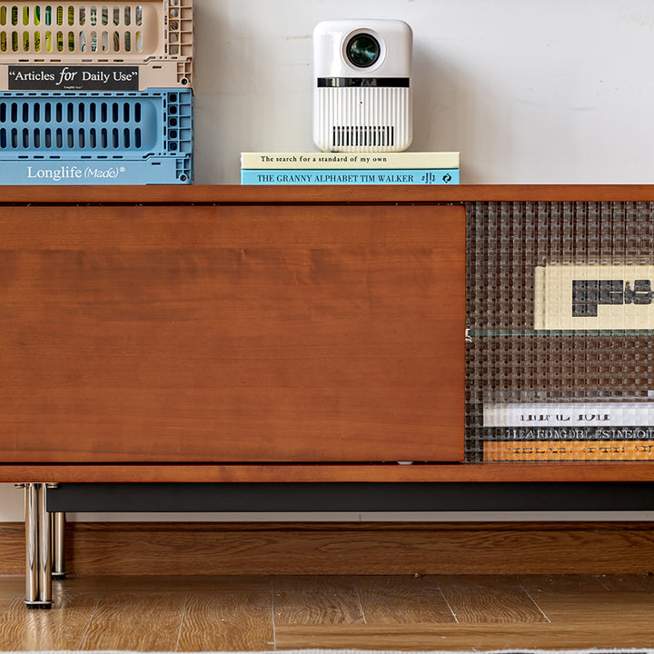 Vintage boxwood tv console pinecone in close up details.