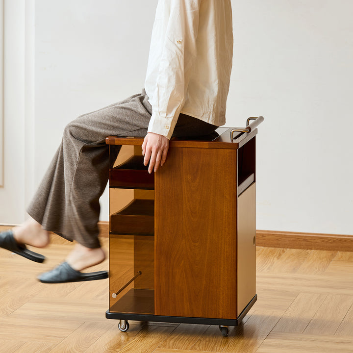 Vintage boxwood wheeled trolley side table moonrise in still life.