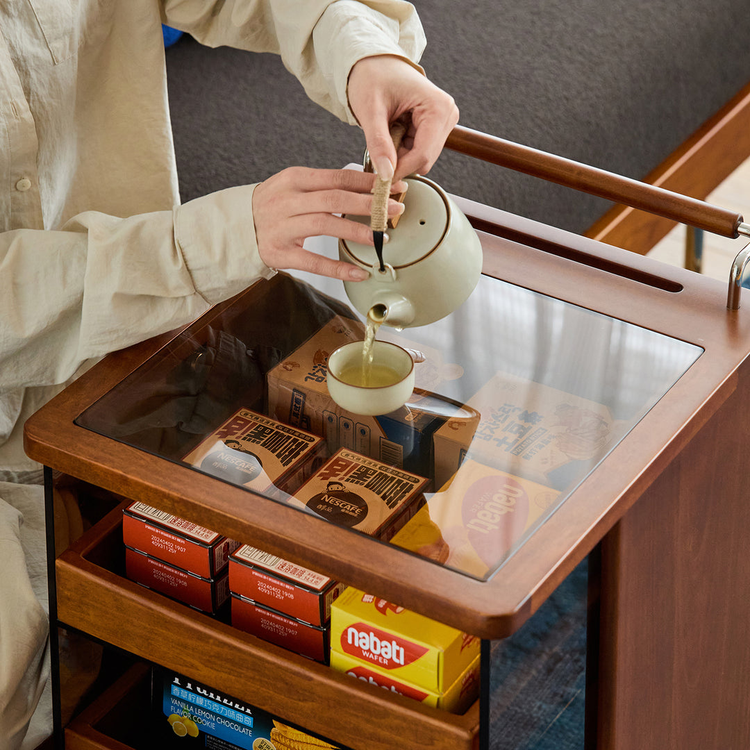 Vintage boxwood wheeled trolley side table moonrise in close up details.