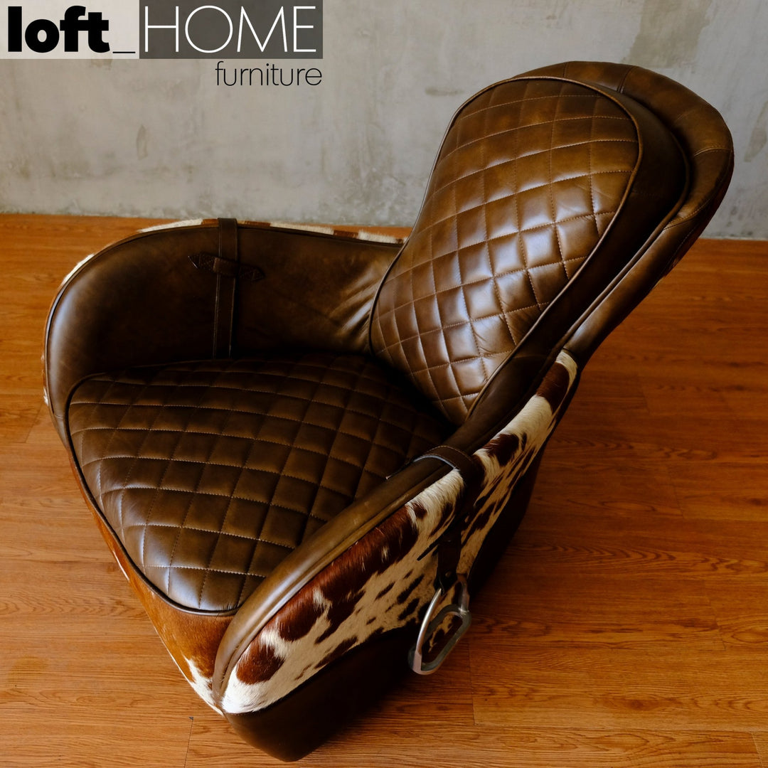Vintage cowhair genuine leather 1 seater sofa moo in close up details.