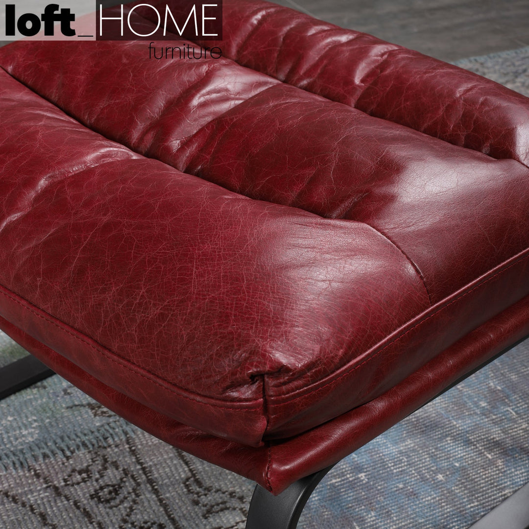 Vintage genuine leather 1 seater sofa bardo in close up details.