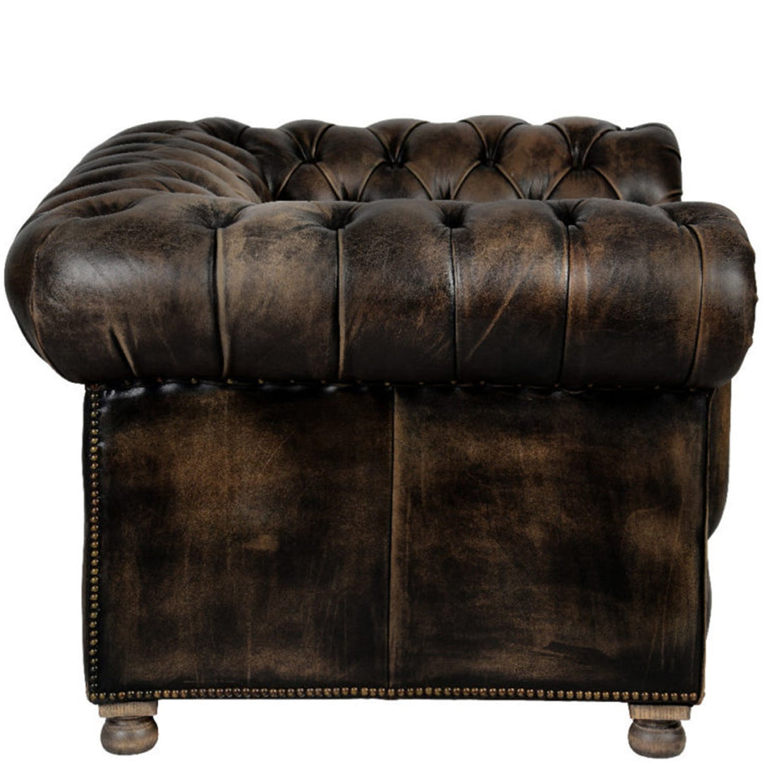 Vintage genuine leather 1 seater sofa chesterfield button in details.
