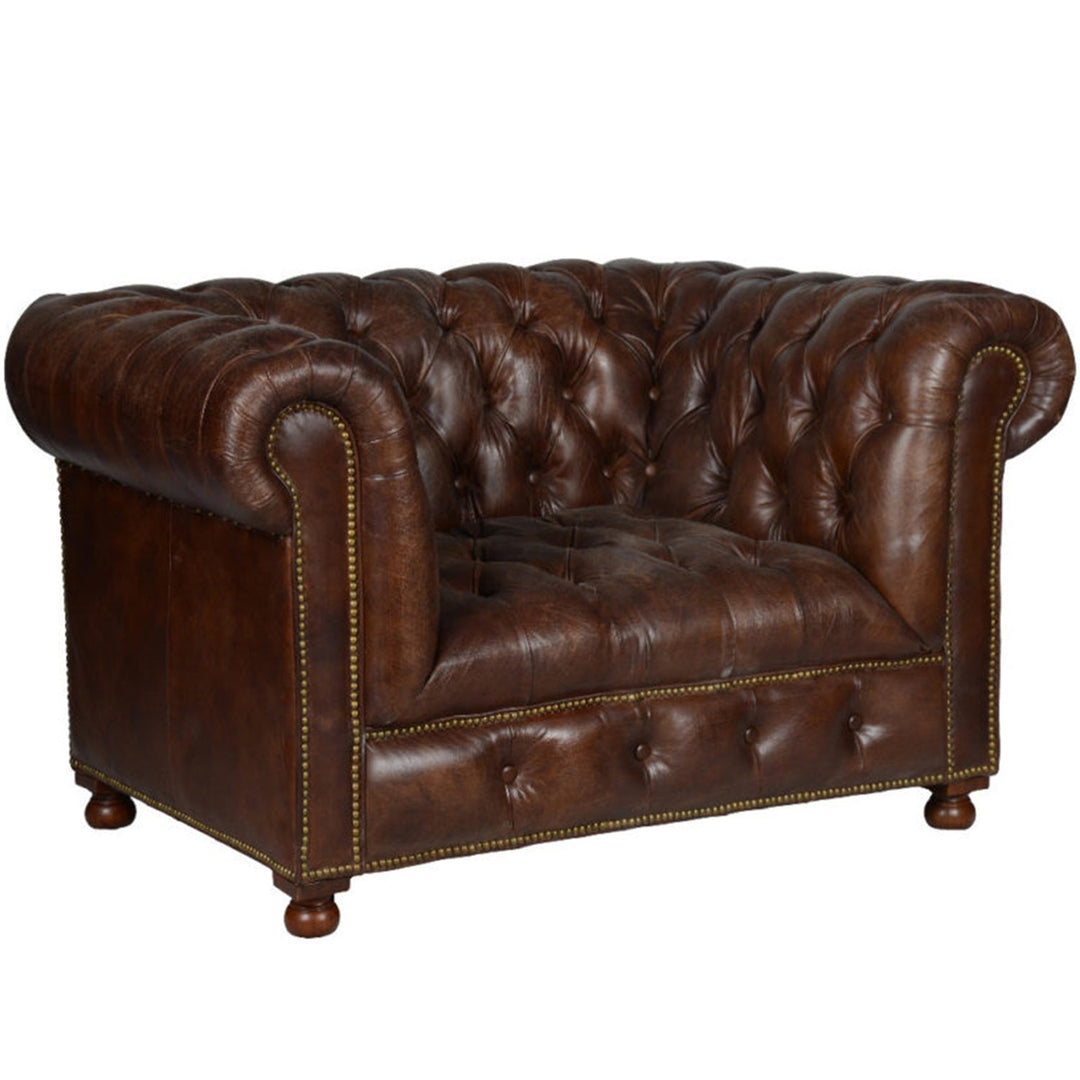 Vintage genuine leather 1 seater sofa chesterfield button in close up details.