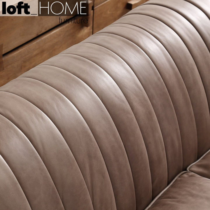 Vintage genuine leather 1 seater sofa elis in close up details.