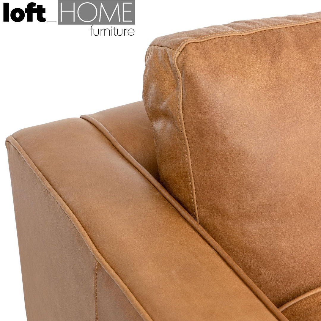 Vintage genuine leather 1 seater sofa olga in still life.