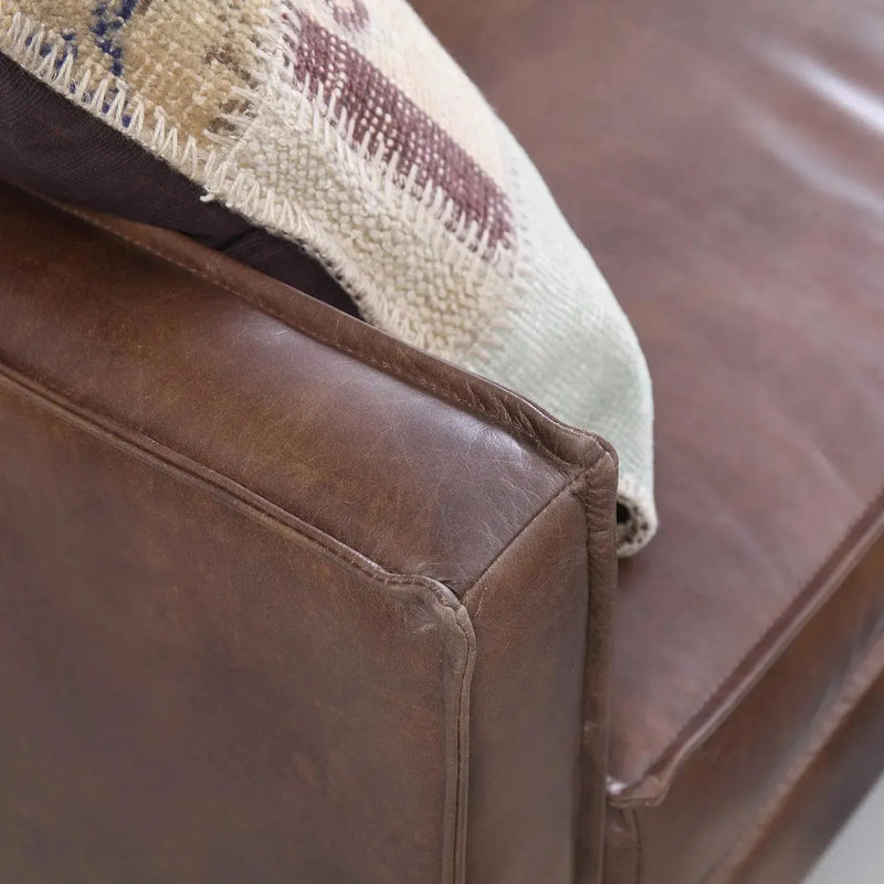 Vintage genuine leather 2 seater sofa belgian in panoramic view.