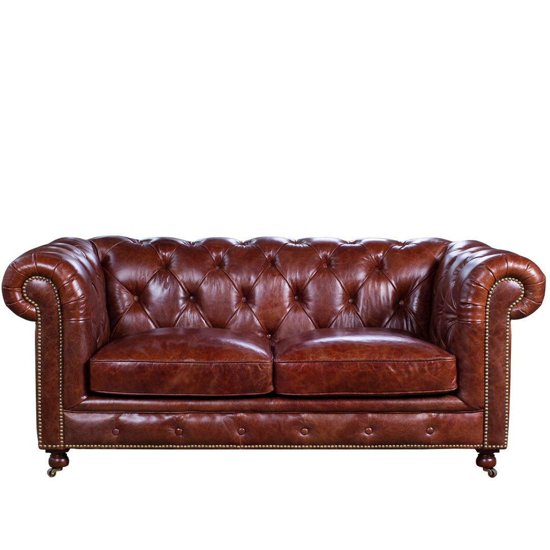 Vintage genuine leather 2 seater sofa chesterfield classic in white background.