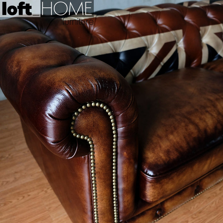Vintage genuine leather 2 seater sofa chesterfield union jack in still life.