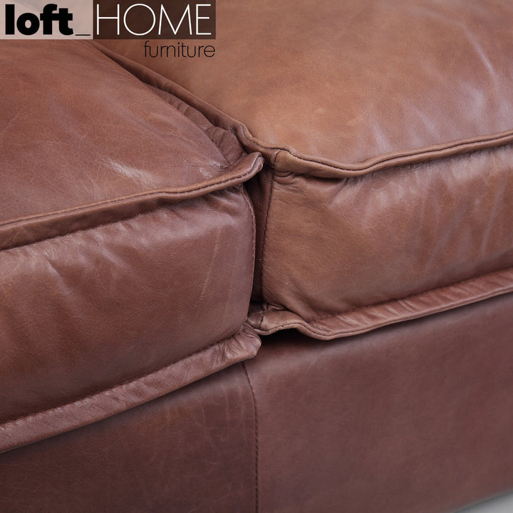 Vintage genuine leather 3 seater sofa brown whisky in still life.