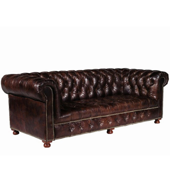 Vintage genuine leather 3 seater sofa chesterfield button in details.