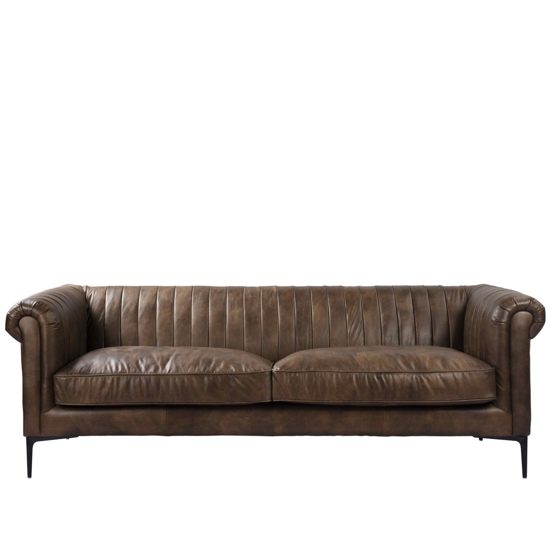 Vintage genuine leather 3 seater sofa elis in white background.