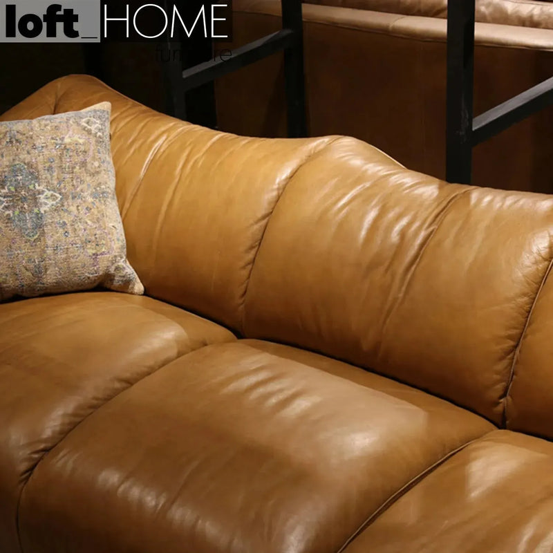 Vintage genuine leather 4 seater sofa beanbag with context.