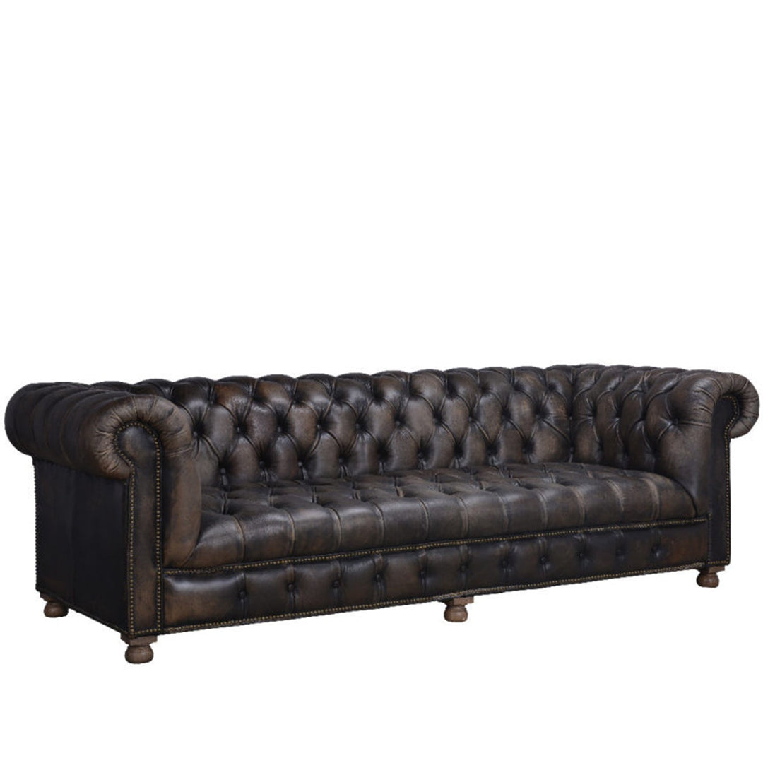 Vintage genuine leather 4 seater sofa chesterfield button in close up details.