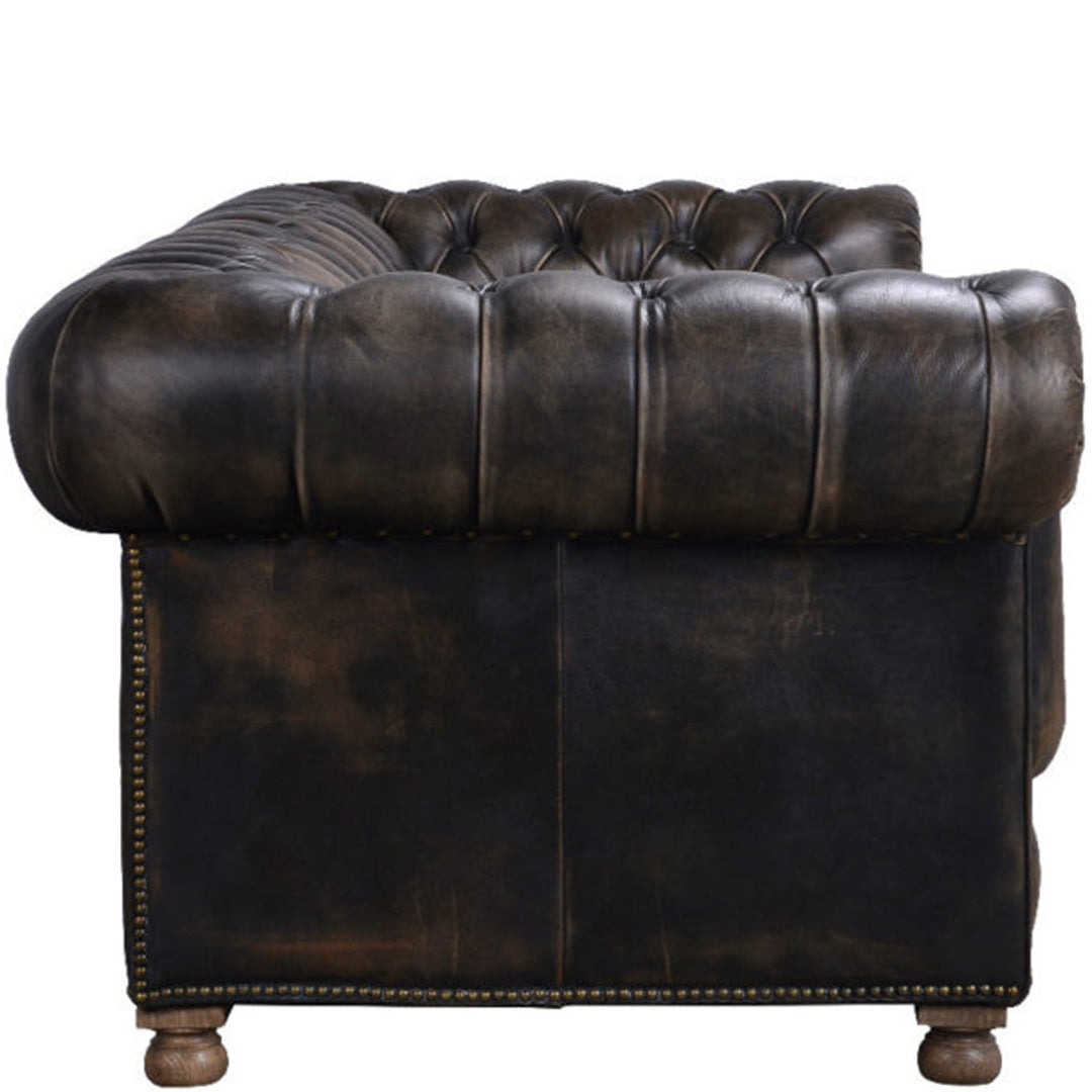 Vintage genuine leather 4 seater sofa chesterfield button in still life.