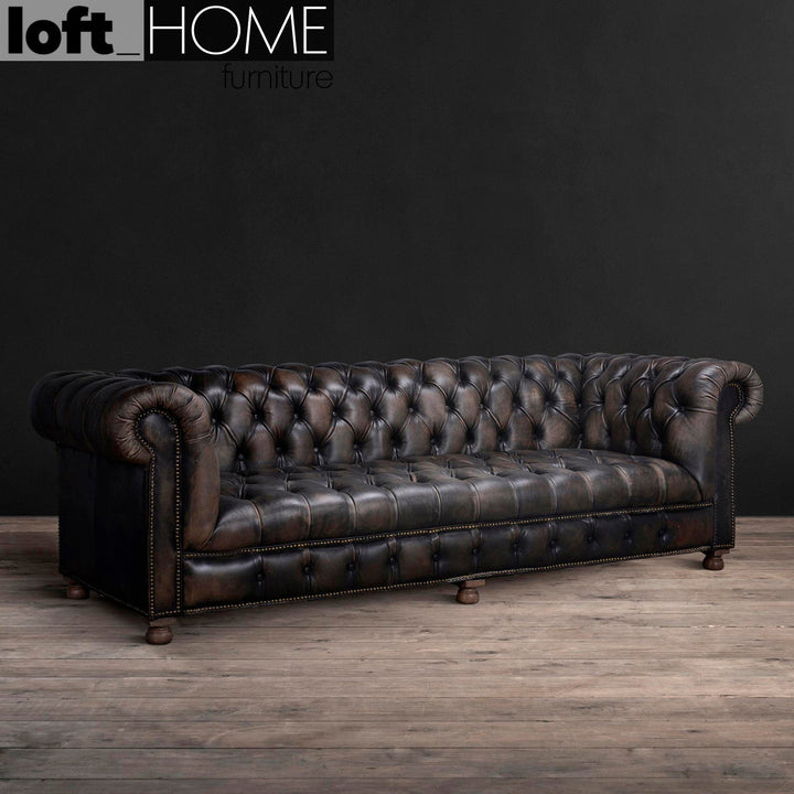 Vintage genuine leather 4 seater sofa chesterfield button in details.