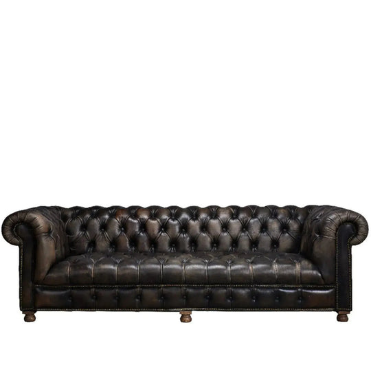 Vintage genuine leather 4 seater sofa chesterfield button in white background.