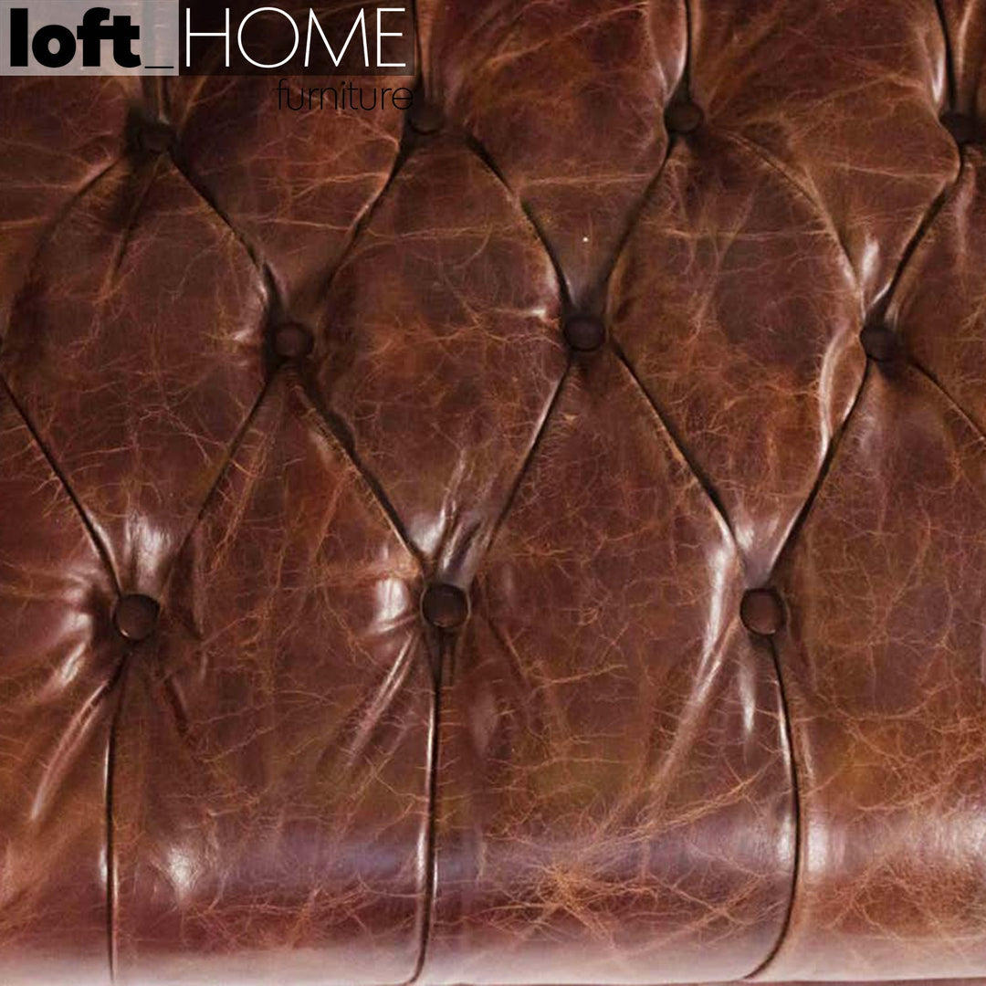 Vintage genuine leather 4 seater sofa chesterfield button in real life style.