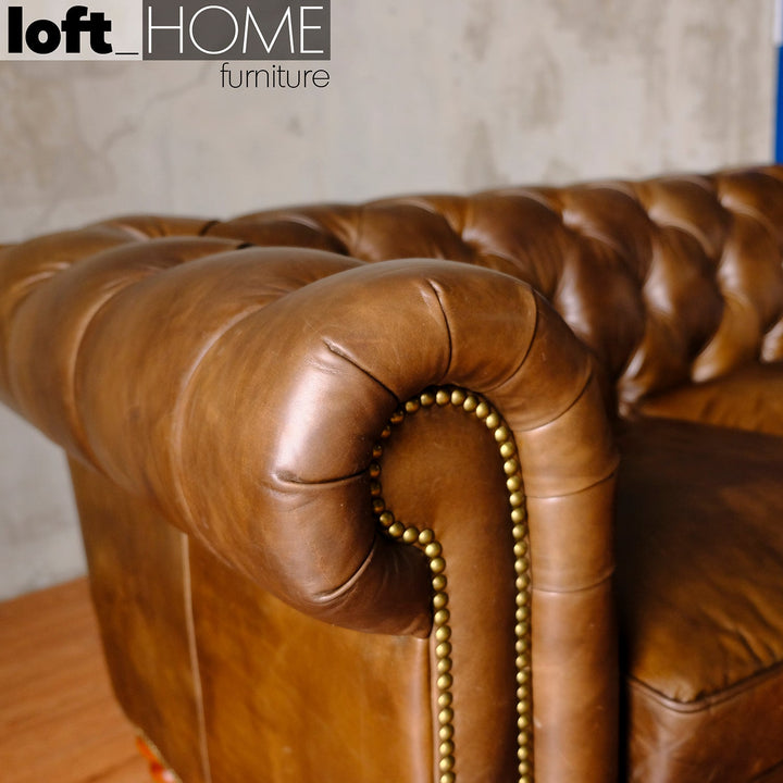 Vintage genuine leather 4 seater sofa chesterfield classic in close up details.