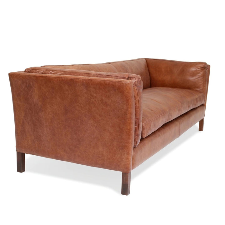 Vintage genuine leather 4 seater sofa reggio in still life.