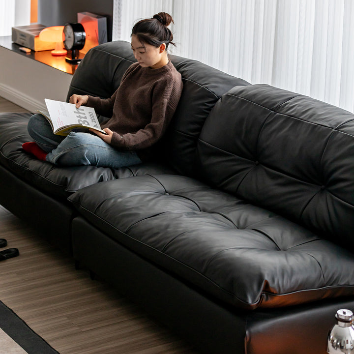 Vintage genuine leather 4 seater sofa riga in close up details.