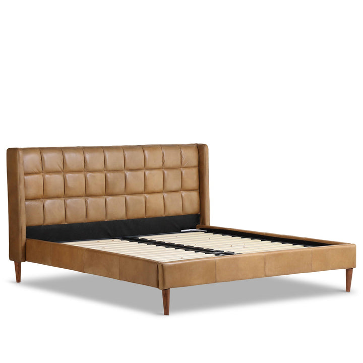 Vintage genuine leather bed frame tuxedo in white background.