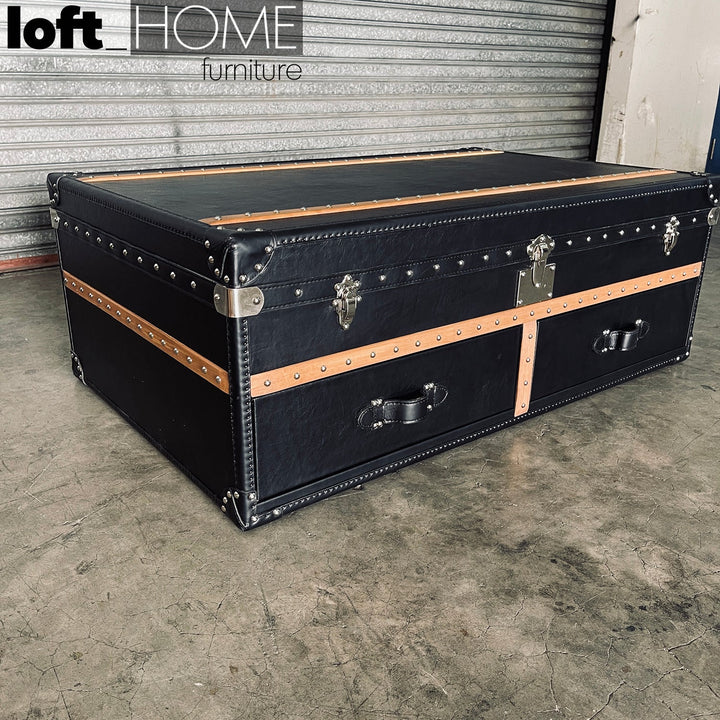 Vintage genuine leather coffee table ox trunk with context.