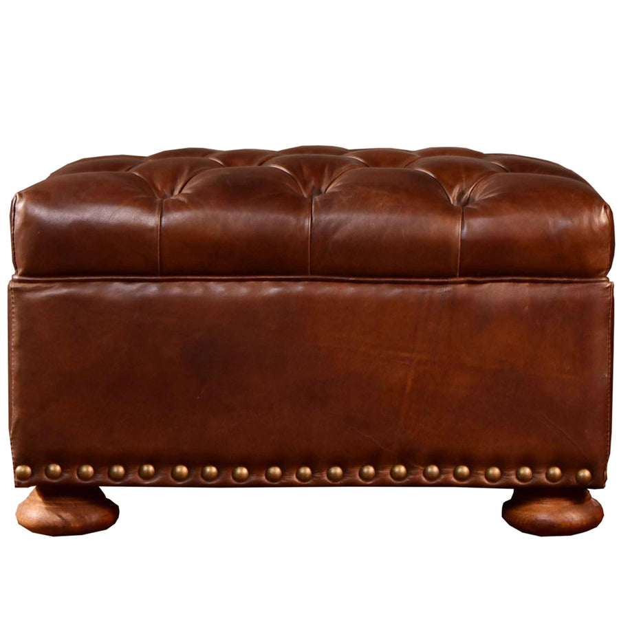 Vintage genuine leather ottoman chesterfield in white background.