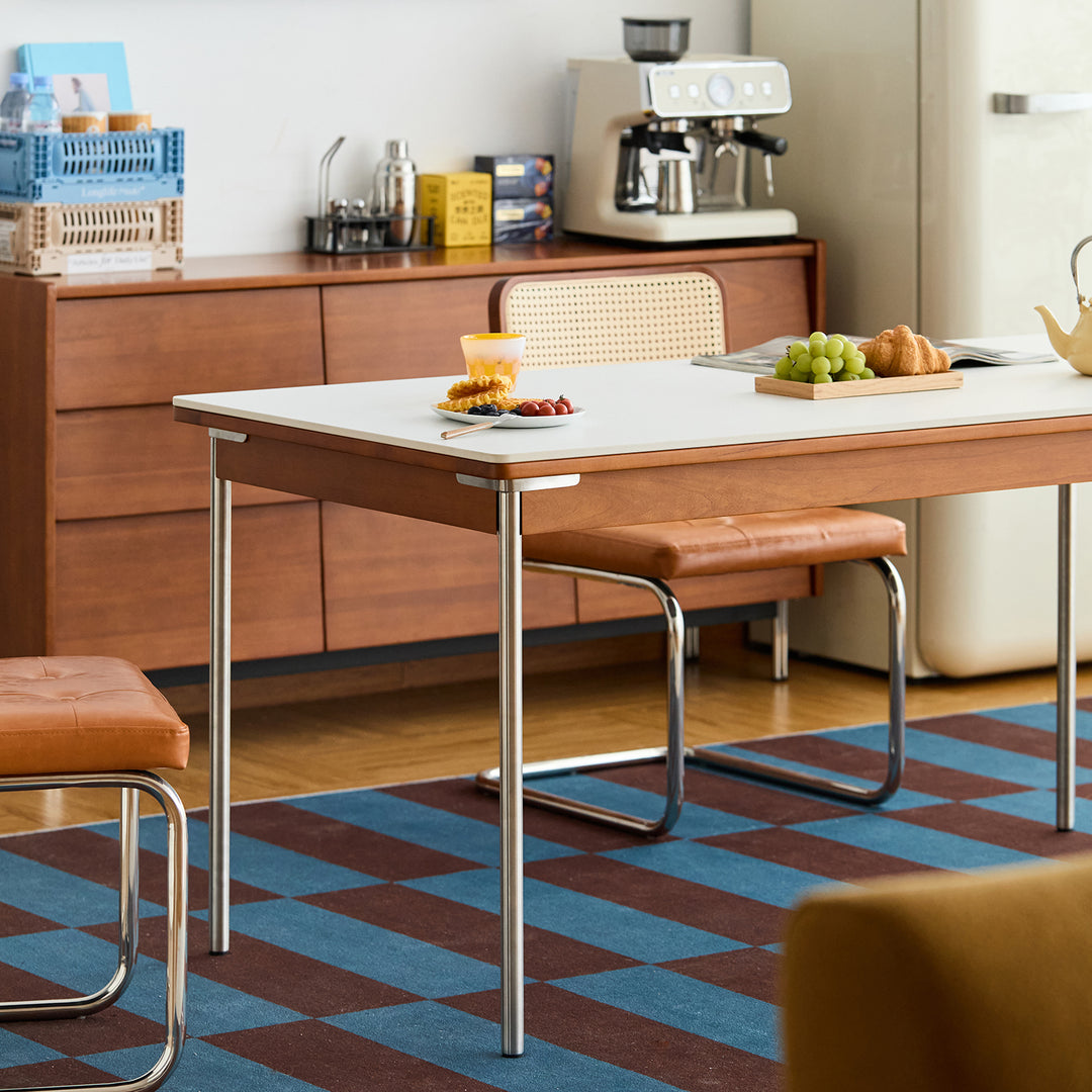 Vintage sintered stone boxwood dining table pinecone with context.