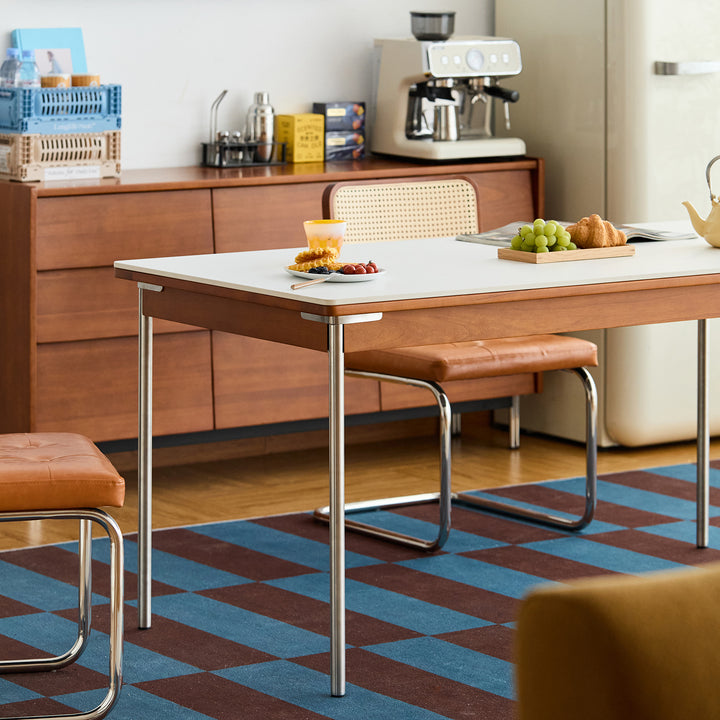 Vintage sintered stone boxwood dining table pinecone with context.