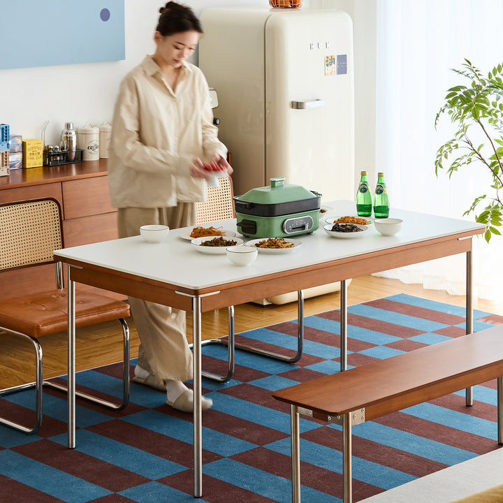 Vintage sintered stone boxwood dining table pinecone in close up details.