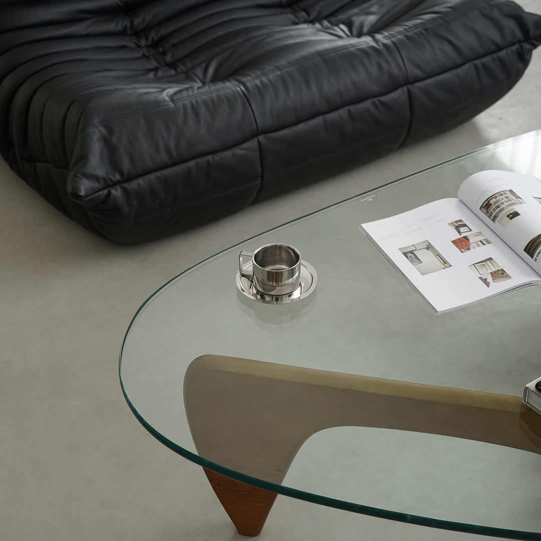 Vintage tempered glass coffee table noguchi with context.