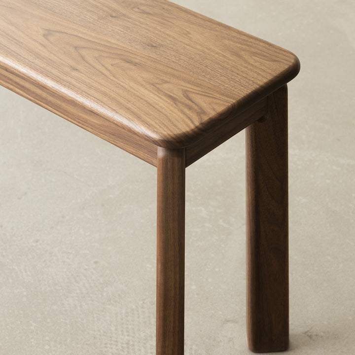 Vintage walnut wood dining bench riverin in close up details.