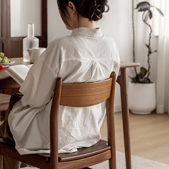 Vintage walnut wood dining chair chrono with context.