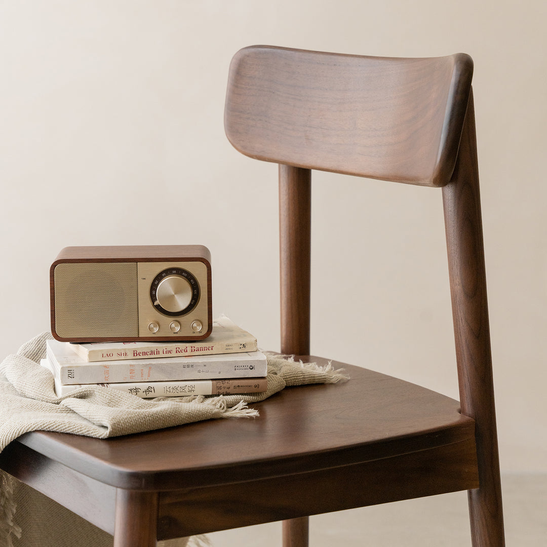 Vintage walnut wood dining chair green in panoramic view.