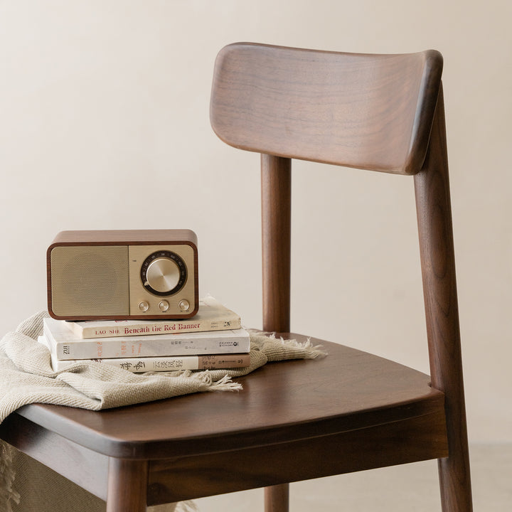 Vintage walnut wood dining chair green in panoramic view.